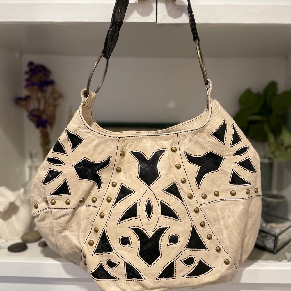 Leather hobo bag with leather designs